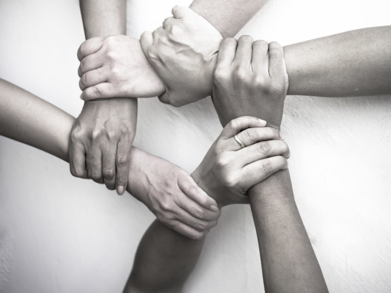 business group United Hands together - teamwork concepts.